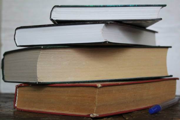 istock a stack of old and new books on the table 1226194987