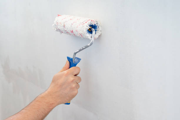 istock painting roller wall with white paint. without people. 1226195915