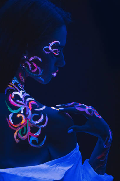 istock rear view on slender woman with fluorescent make-up 1226195993