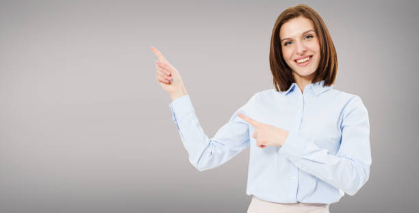 istock modern cute brunette woman pointed on grey background isolated 1226196200