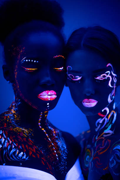 istock two girl with fluorescent make-up isolated 1226196272