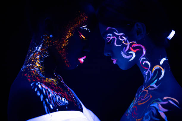 istock girls with fluorescent make-up opposite each other 1226196451