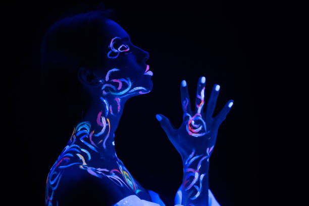 istock prayer woman with fluorescent prints on skin 1226196685