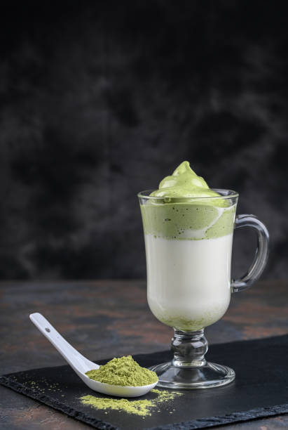 istock Dalgona Matcha Latte, a creamy whipped matcha, on dark background. Matcha green tea. 1226196922