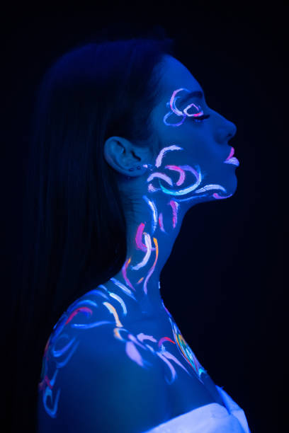 istock side view on beautiful young woman with fluorescent prints on skin 1226197994