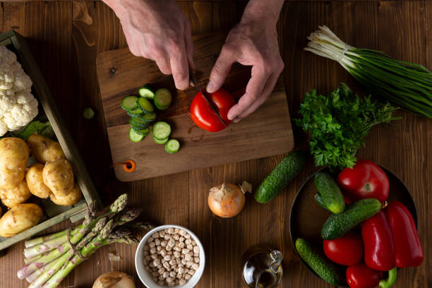 istock Men hands cooking vegan food 1226201454