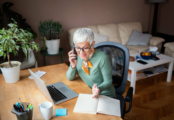 istock Mature woman working indoors at home office 1226203178
