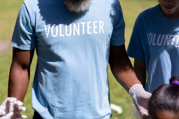 istock Volunteer people collecting garbage 1226204786