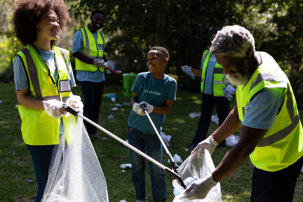 istock Multi-generation mixed race family collecting garbage 1226204887