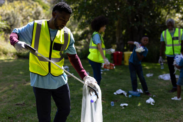 istock Multi-generation mixed race family collecting garbage 1226204894
