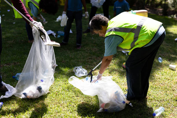 istock Multi-generation mixed race family collecting garbage 1226204906