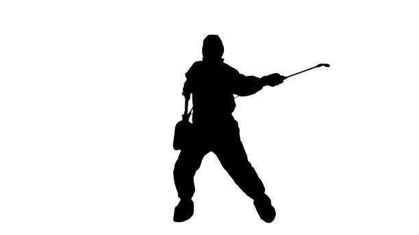 istock Silhouette Man wearing an NBC personal protective equipment spray disinfectant and dancing 1226205428