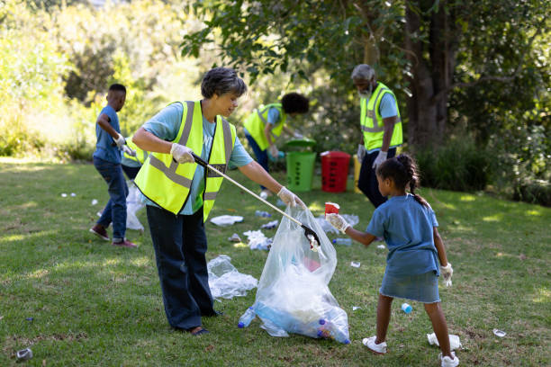 istock Multi-generation mixed race family collecting garbage 1226206309