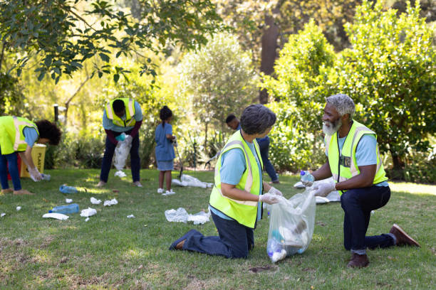 istock Senior mixed race couple collecting garbage 1226206596
