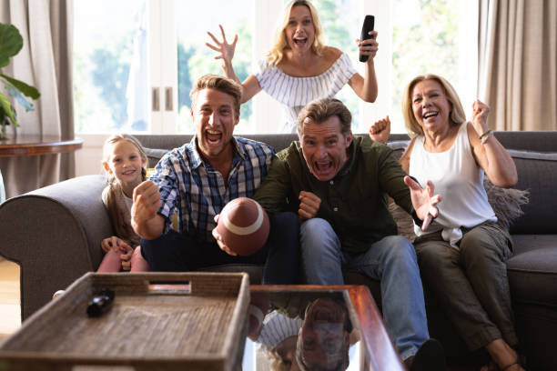 istock Multi-generation Caucasian family sitting on a couch together and watching a game 1226207051
