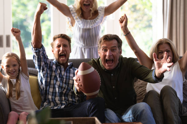 istock Multi-generation Caucasian family sitting on a couch and watching a game 1226207068