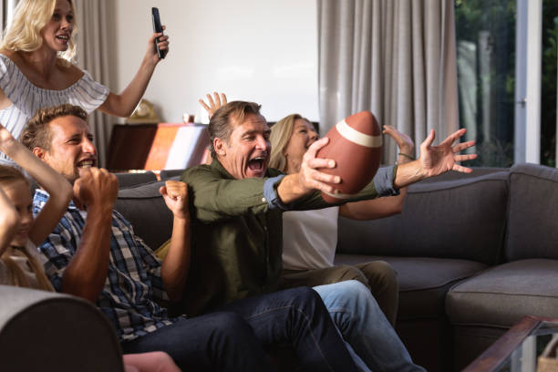 istock Multi-generation Caucasian family sitting on a couch together and watching a game 1226207094