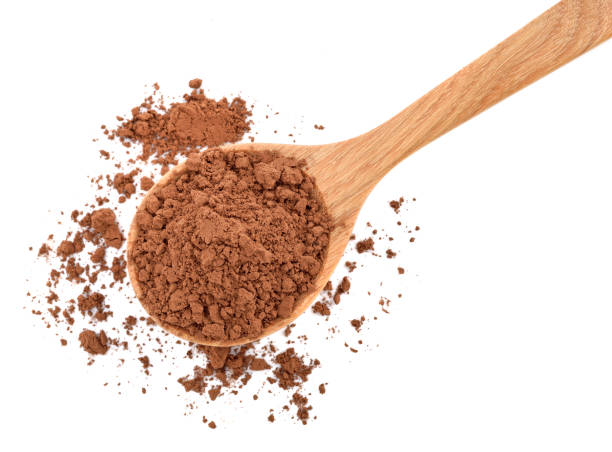 istock Cocoa powder in a wood spoon on white 1226207224