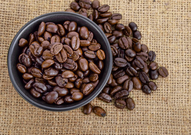 istock Coffee beans on bowl put on sack 1226207873