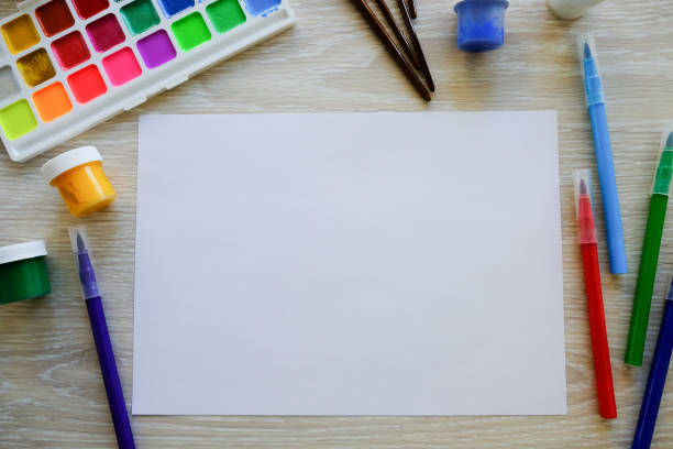 istock Drawing album, colored pencils and felt-tip pens on the table. Creativity concept 1226208129