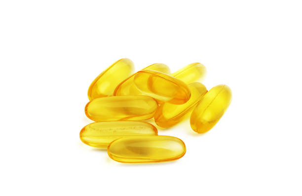 istock Fish oil capsules on white background 1226208821