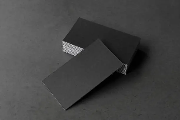 Photo of Business card on black background.