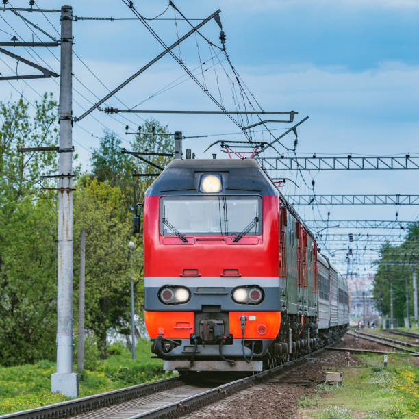 istock Passenger train moves from the station at evening time.. 1226215025