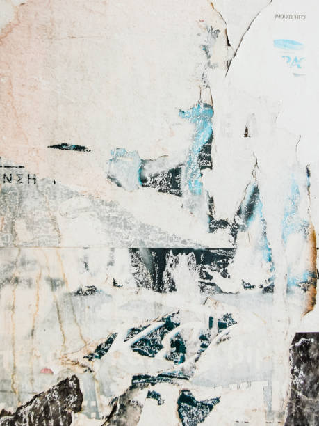 istock Vintage old posters sticked and torn on wall for your grunge background 1226215553