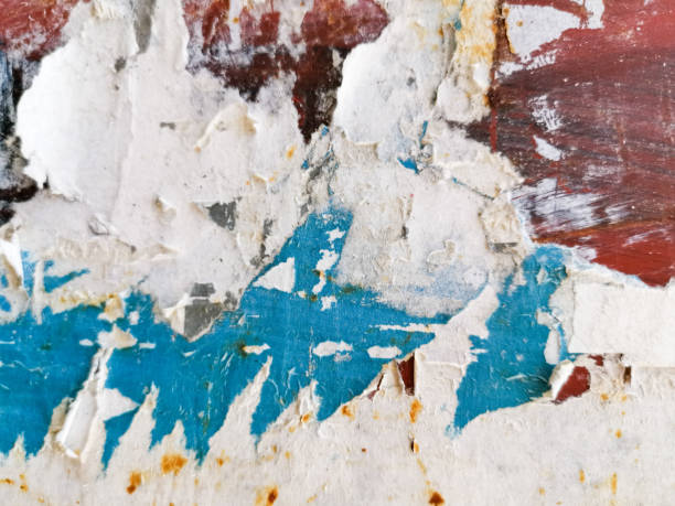 istock Vintage old posters sticked and torn on wall for your grunge background 1226215569