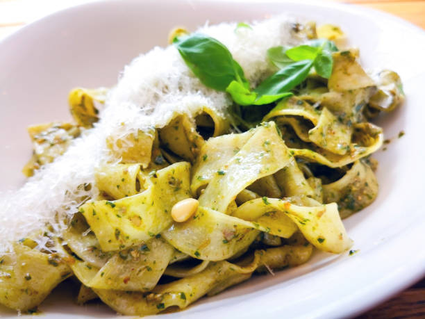istock Pasta with pesto sauce and nuts on a the table 1226216172