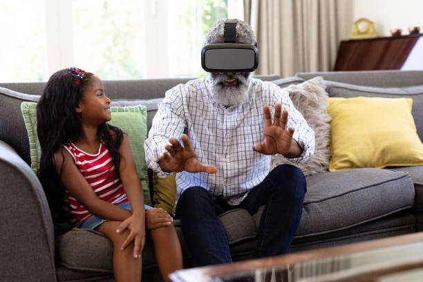 istock Senior African American man and his granddaughte Using vr headset 1226216565