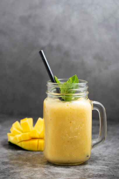 istock Summer mango and pineapple smoothie. Fresh fruit yellow smoothie. 1226221195