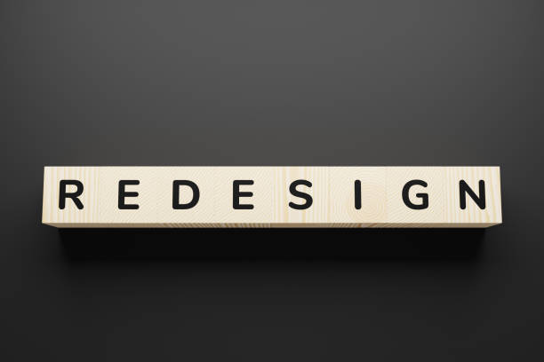 istock Redesign - word on wooden cubes, top view. 1226221943