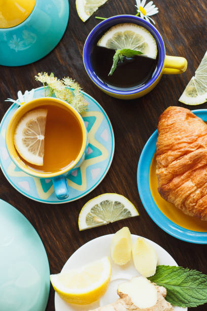 istock Cup with green tea and lemon on the wooden background 1226228020