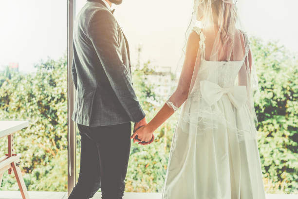 istock Bride and groom hold hands on the wedding day 1226229165