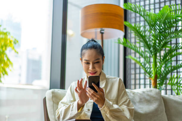 istock Young Asian Millennial text messaging a friend 1226230255