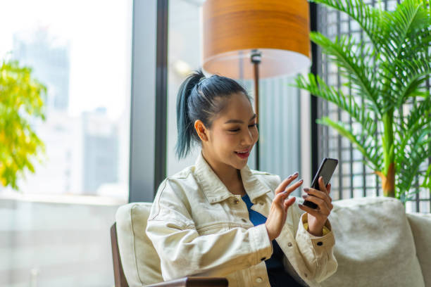 istock Young Asian Millennial text messaging a friend 1226232462