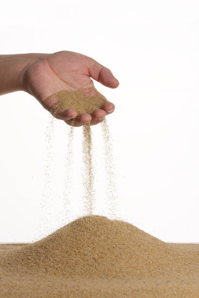 istock Stop motion. From the palm of the sand flows down. Male hand. 1226233856
