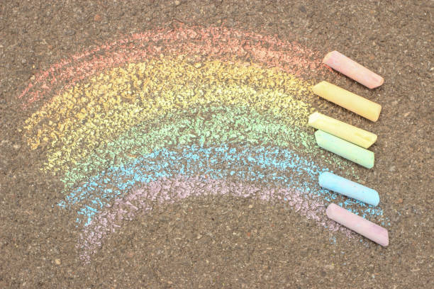 istock The rainbow is drawn on the asphalt, sidewalk with colored crayons, chalks 1226234469