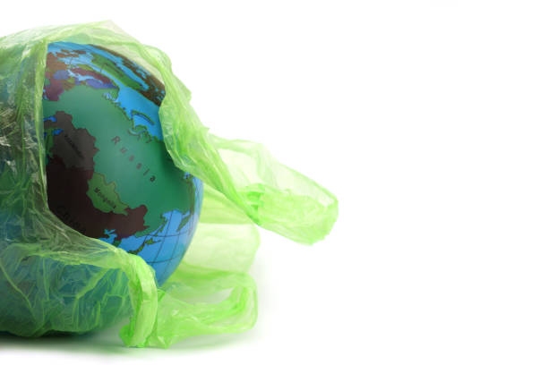 istock Globe in a plastic garbage bag is isolated on white. Concept of an environmental disaster on the planet 1226234591