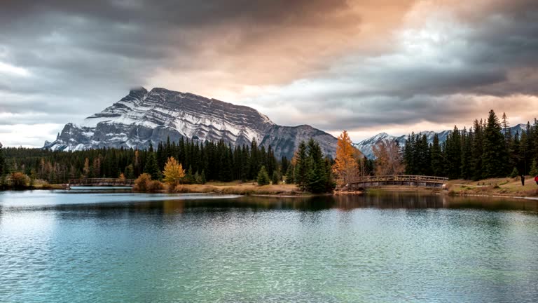 Mount Rundle with wooden bridge in autumn park at Cascade Ponds, Banff national park