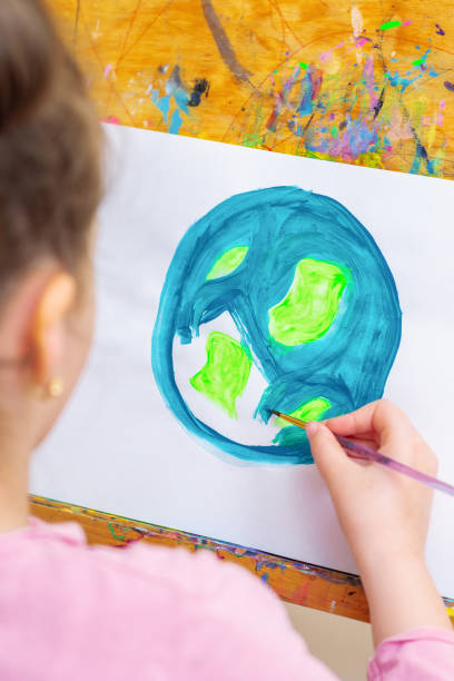 istock Little girl is drawing earth. 1226236528