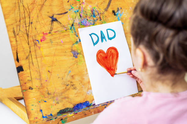 istock Child is drawing Father's day greeting card. 1226236550