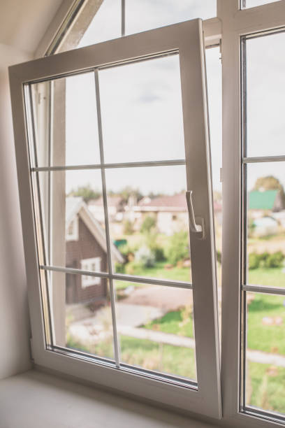 plastic window in the window in the attic is partially open for ventilation - window sun sunlight vertical imagens e fotografias de stock