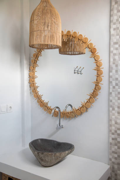 istock Simple contemporary bathroom in boho style. Small budget-friendly powder room in beachy boho chic vibes. 1226237846