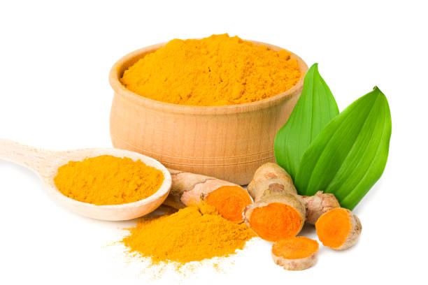 istock Turmeric powder with turmeric root isolated on white background 1226238482