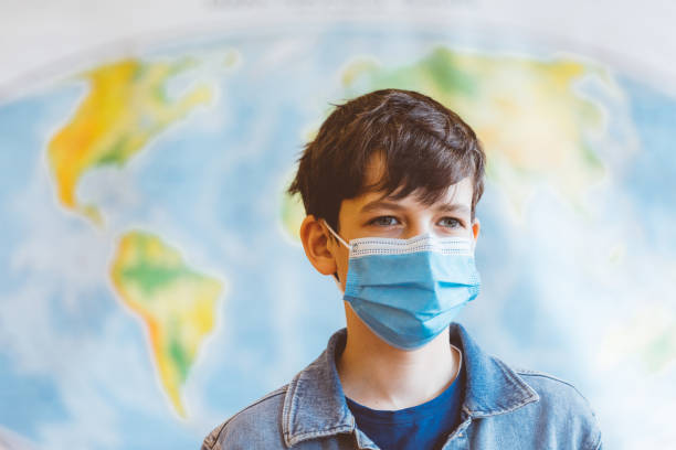 istock High school students at school, wearing N95 face mask 1226241084