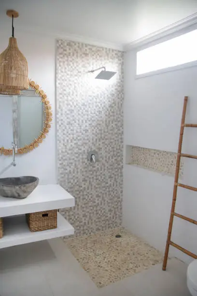 Simple contemporary bathroom in boho style. Small budget-friendly powder room in beachy boho chic vibes.