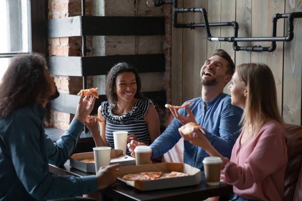 istock Happy diverse friends have fun eating out together 1226241195