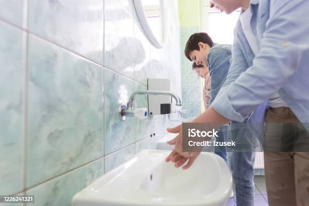 High School Students Washing Hands Stock Photo - Download Image Now - Education, Toilet, Hand